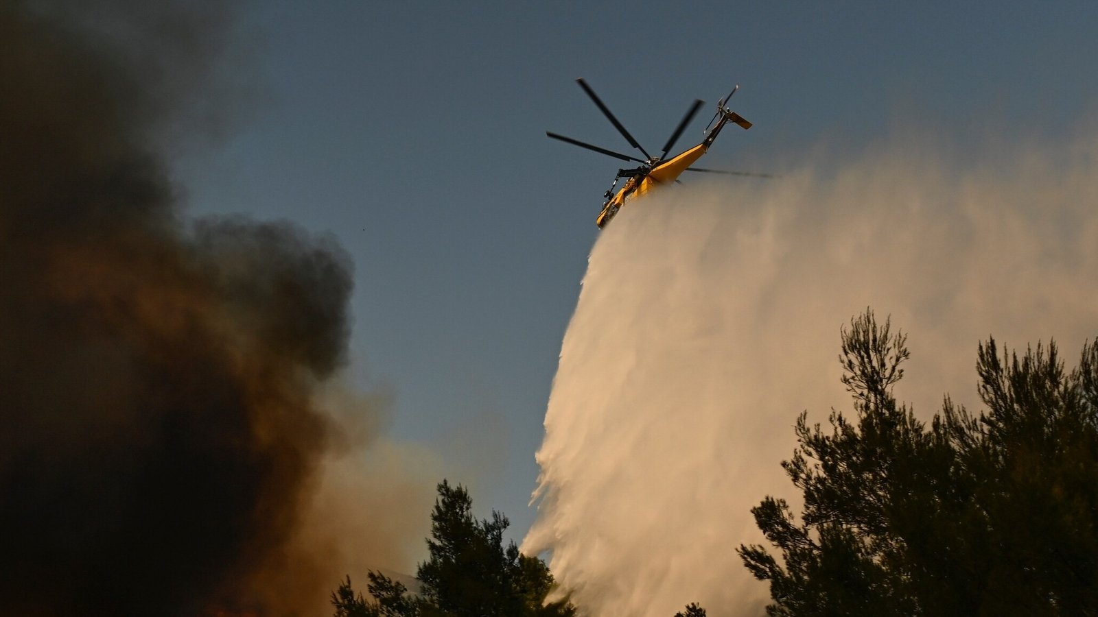 Two firefighting helicopters collide while battling Greece wildfire