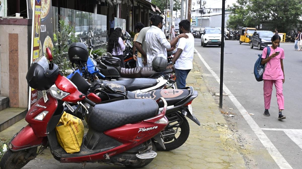 Parking motorcycles on footpath inconveniences pedestrians in Coimbatore