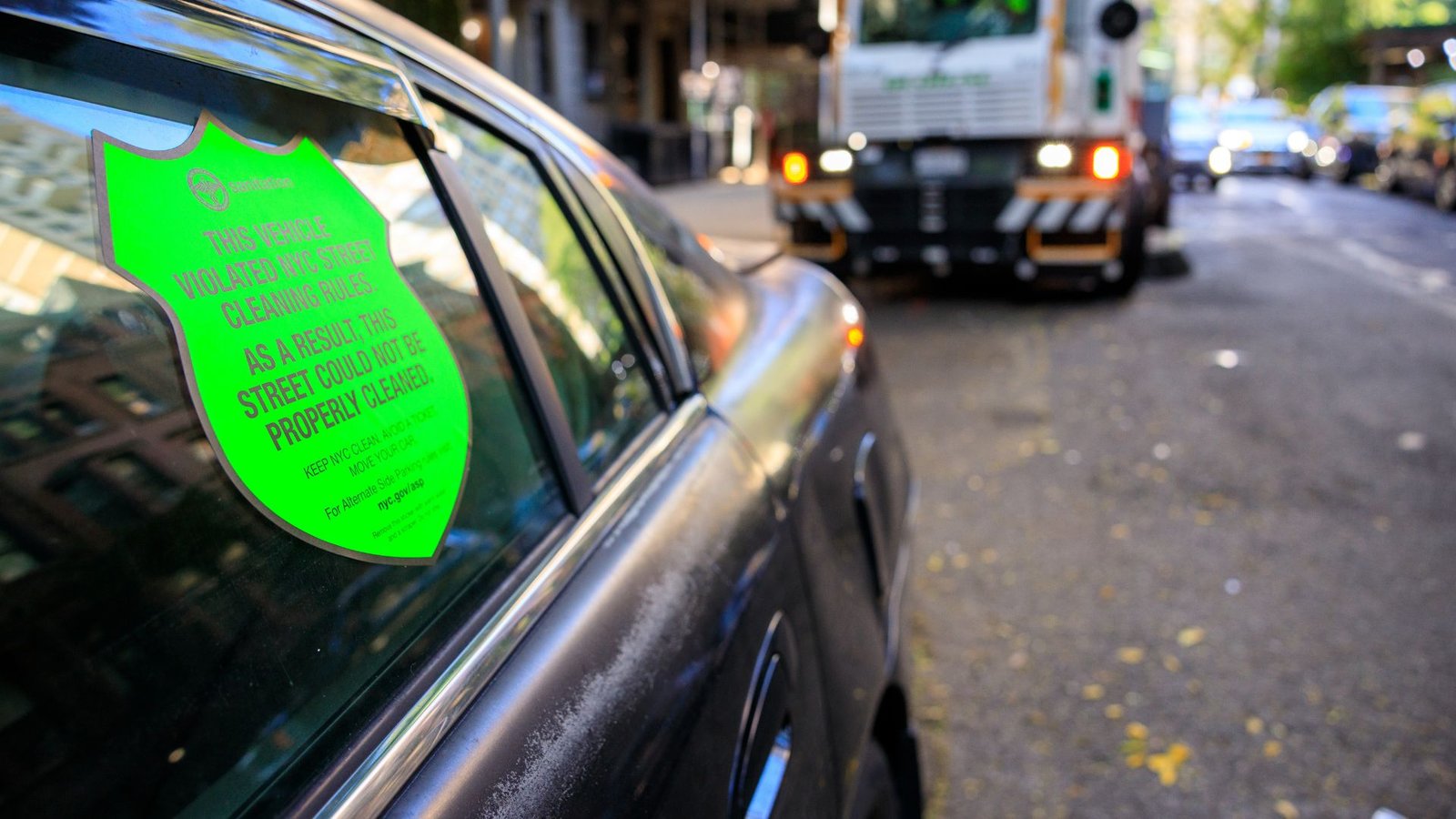 NYC shames parking-rule violators with big neon stickers pasted onto cars