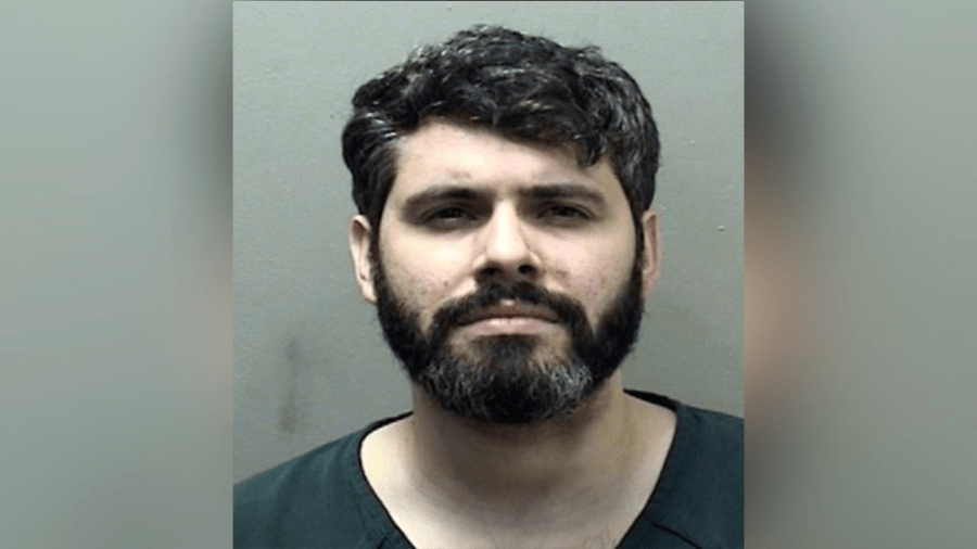 Bloomington man already in jail arrested after threatening to stab officer in the neck