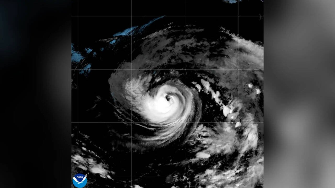 Tropical Storm Karina strengthens into a hurricane in the Pacific