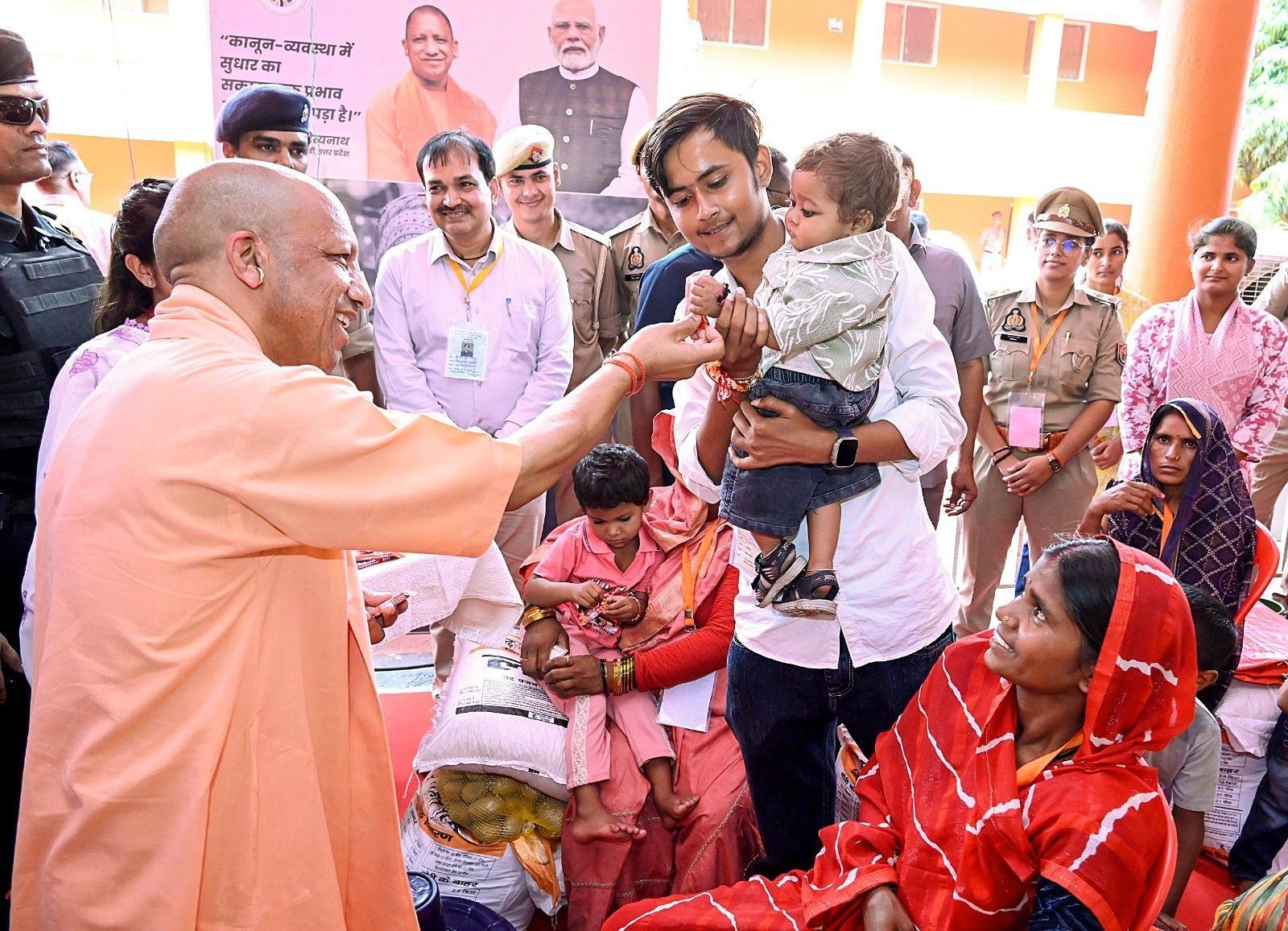 Yogi meets flood-hit families in Chitrakoot, hands over relief aid
