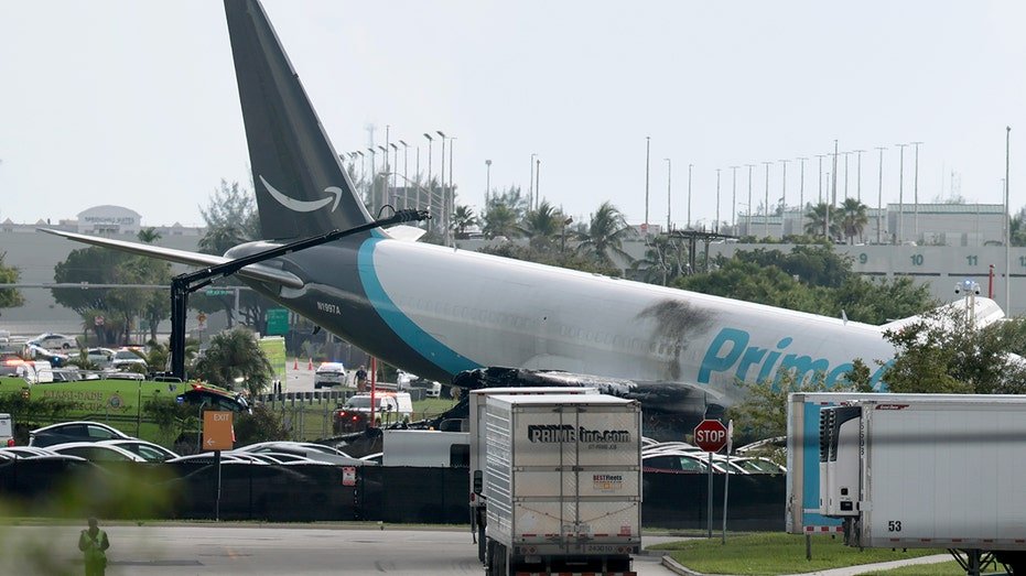 Amazon cargo plane overruns Miami airport runway and strikes 'multiple' vehicles; 5 dead, 5 injured