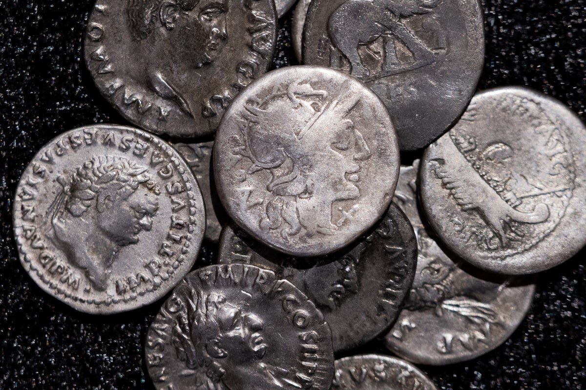 Amateur archaeologist unearths huge Roman silver coin treasure trove in Germany
